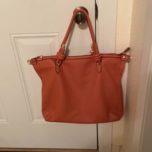 New without tags. Malibu skye tote orange colored. Soft Faux leather